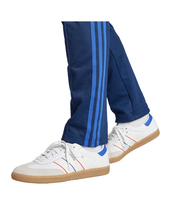 adidas olympique lyon 75 tréninkové kalhoty modré