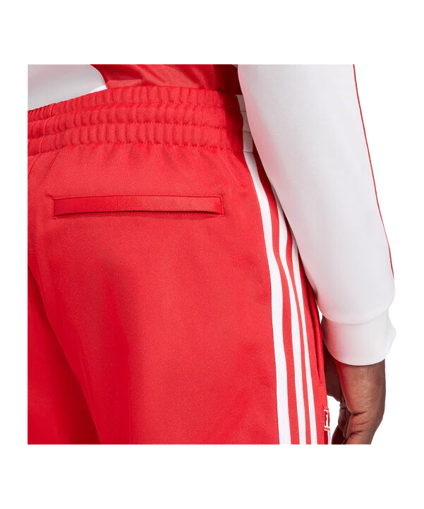 Červené tréninkové kalhoty adidas peru